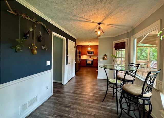 4114 Falcon Shores Ct NW, Acworth, GA 30101 - dining space with a textured ceiling, dark wood-style flooring, and ornamental molding