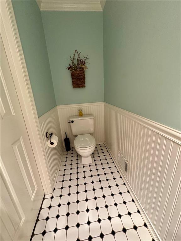 4114 Falcon Shores Ct NW, Acworth, GA 30101 - bathroom featuring a wainscoted wall and toilet