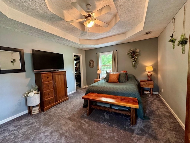 4114 Falcon Shores Ct NW, Acworth, GA 30101 - bedroom featuring a textured ceiling, carpet flooring, a ceiling fan, and a raised ceiling