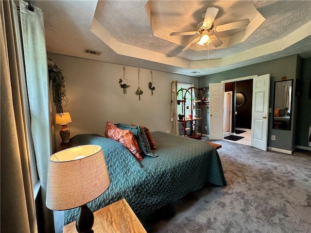 4114 Falcon Shores Ct NW, Acworth, GA 30101 - bedroom with a tray ceiling, carpet, a textured ceiling, and ceiling fan
