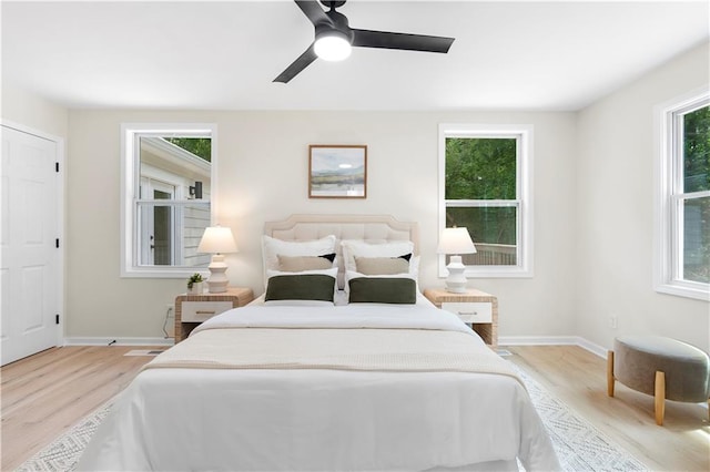 1980 Oakdale Ct SE, Smyrna, GA 30082 - bedroom featuring light wood-style floors, baseboards, and ceiling fan