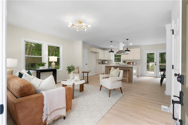 1980 Oakdale Ct SE, Smyrna, GA 30082 - living area featuring a chandelier, light wood-style flooring, french doors, baseboards, and recessed lighting