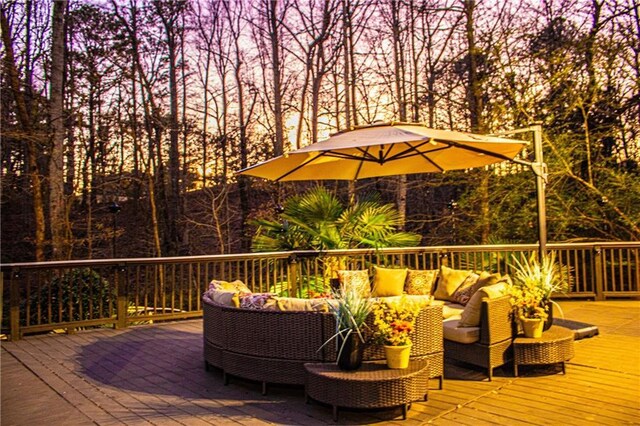 deck at dusk with an outdoor living space