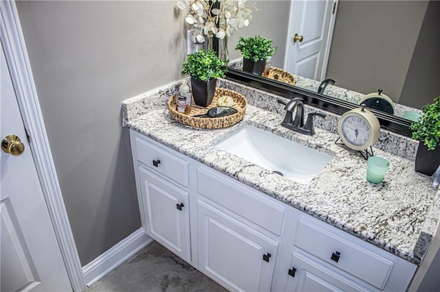 bathroom with vanity and a notable chandelier