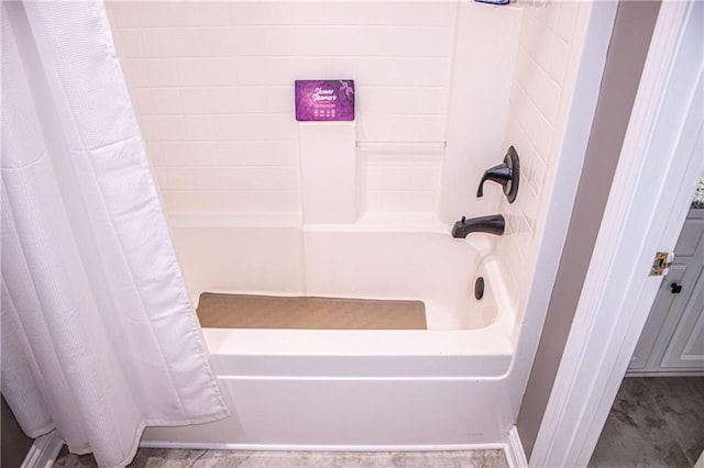 bathroom featuring shower / bathtub combination with curtain