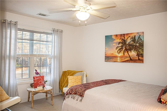 bedroom with ceiling fan and carpet floors