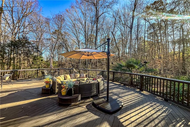 wooden terrace featuring an outdoor hangout area