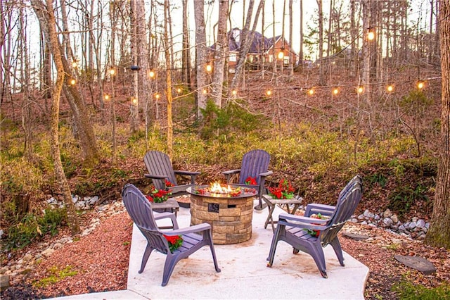 view of patio featuring an outdoor fire pit