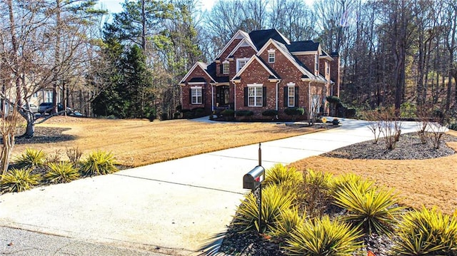 craftsman inspired home with a front lawn