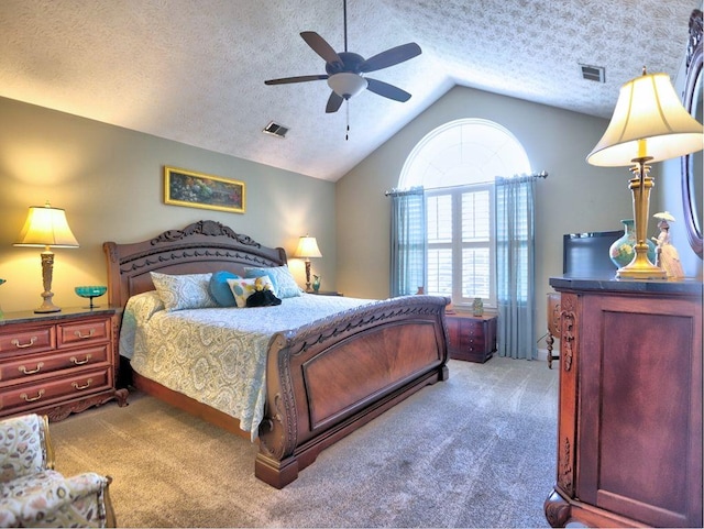 bedroom featuring a textured ceiling, visible vents, carpet floors, and vaulted ceiling