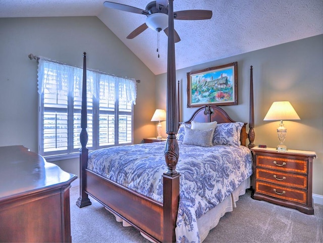 carpeted bedroom featuring ceiling fan and vaulted ceiling