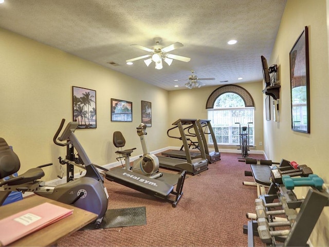 exercise area with recessed lighting, a textured ceiling, baseboards, visible vents, and ceiling fan