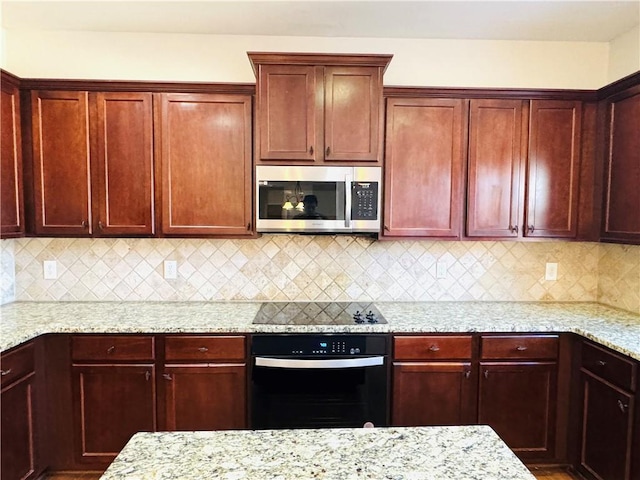 kitchen featuring black electric cooktop, wall oven, light stone counters, and backsplash