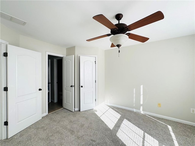 unfurnished bedroom with light carpet and ceiling fan