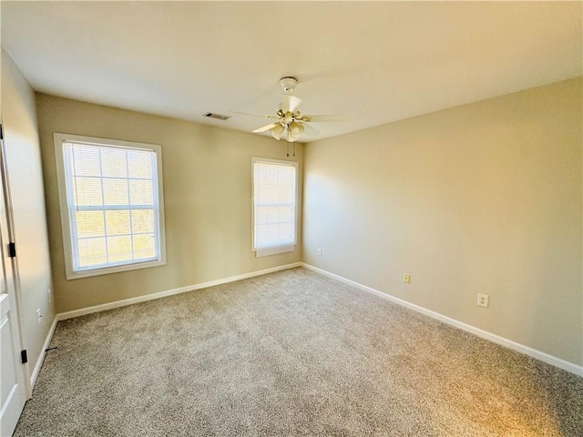 carpeted empty room with ceiling fan