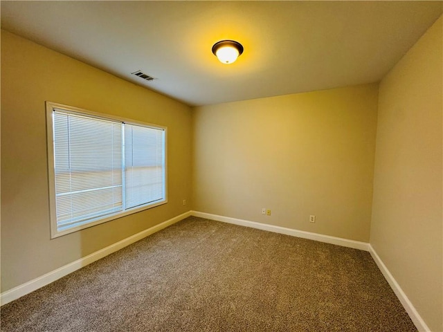 unfurnished room with carpet floors