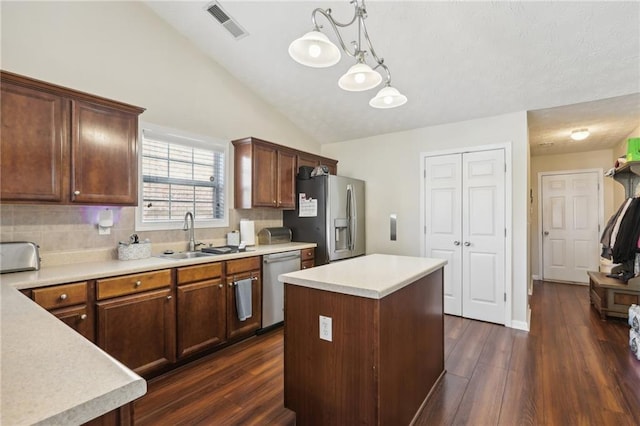 kitchen with a sink, light countertops, visible vents, and stainless steel appliances