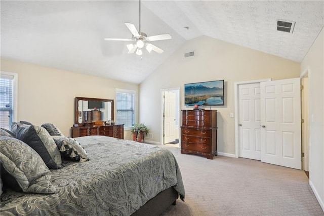 bedroom with visible vents, lofted ceiling, baseboards, and carpet flooring