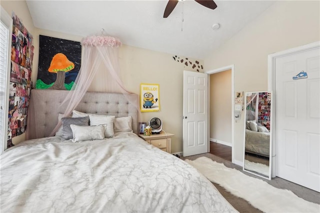 bedroom featuring ceiling fan, baseboards, and lofted ceiling