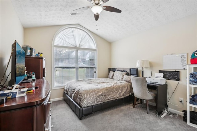 bedroom with visible vents, a ceiling fan, a textured ceiling, carpet, and lofted ceiling