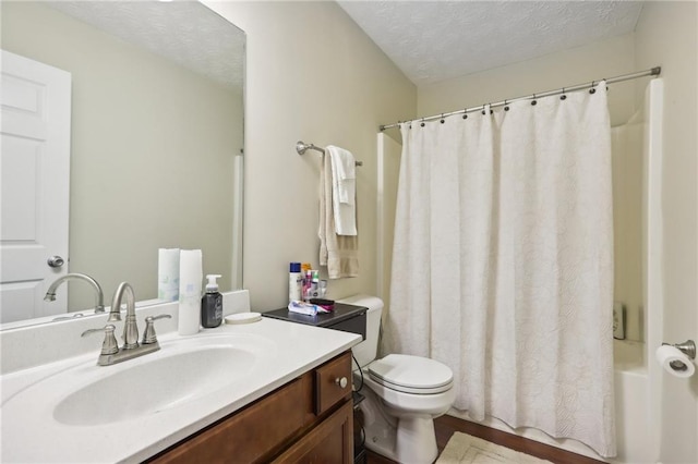 full bathroom featuring vanity, a textured ceiling, shower / tub combo, and toilet