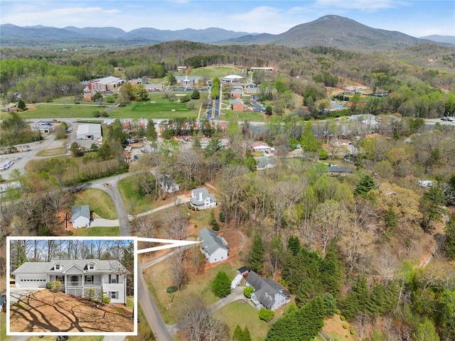 aerial view featuring a mountain view and a residential view