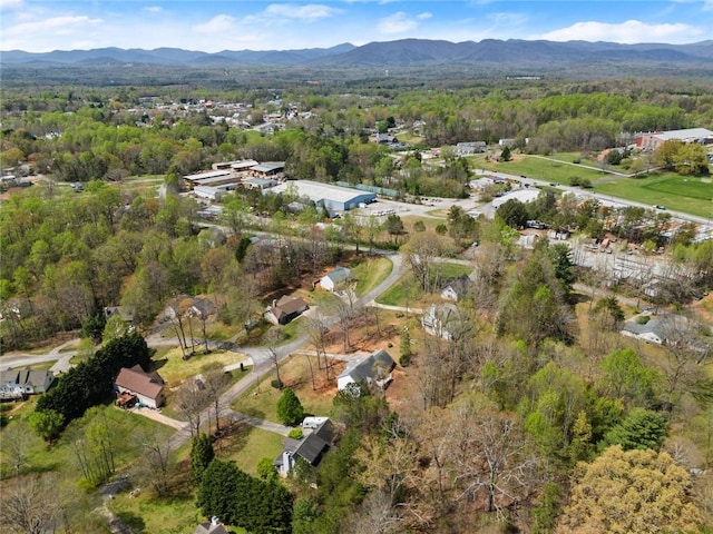 bird's eye view featuring a view of trees and a mountain view