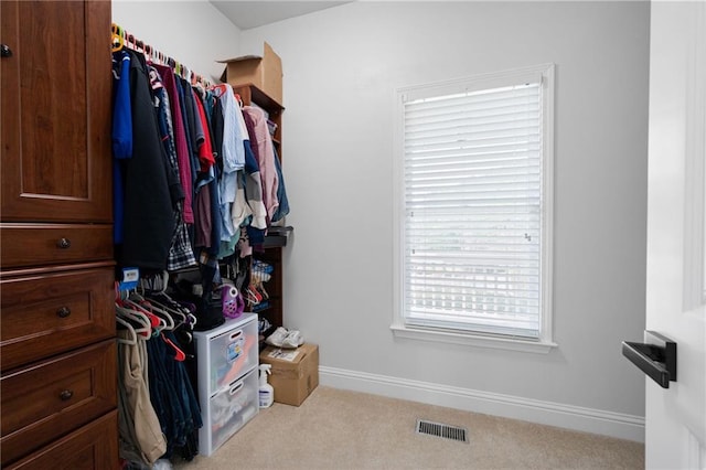 walk in closet with carpet floors and visible vents