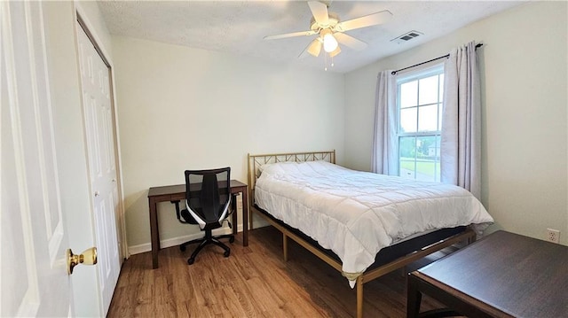 bedroom with wood finished floors and ceiling fan
