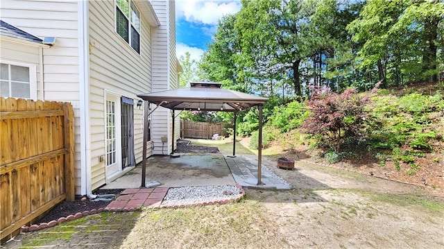 view of yard with a gazebo, a patio, and fence