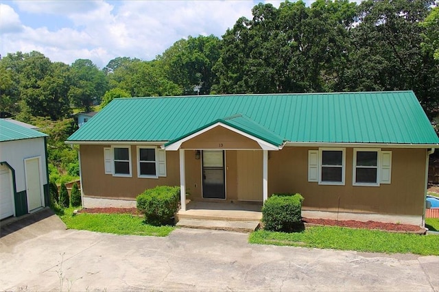 13 Travis Rd, Rossville, GA 30741 - view of front of property with a metal roof and an outdoor structure