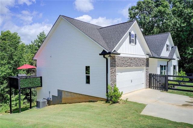 271 Moorings Run, Jasper, GA 30143 - view of property exterior with an attached garage, a shingled roof, driveway, stone siding, and board and batten siding