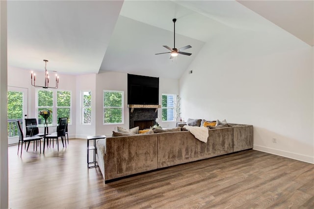 271 Moorings Run, Jasper, GA 30143 - living area featuring healthy amount of natural light, wood finished floors, a chandelier, ceiling fan, and high vaulted ceiling