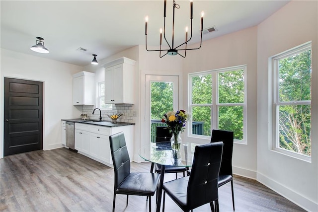 271 Moorings Run, Jasper, GA 30143 - dining area with a chandelier, healthy amount of natural light, and wood finished floors