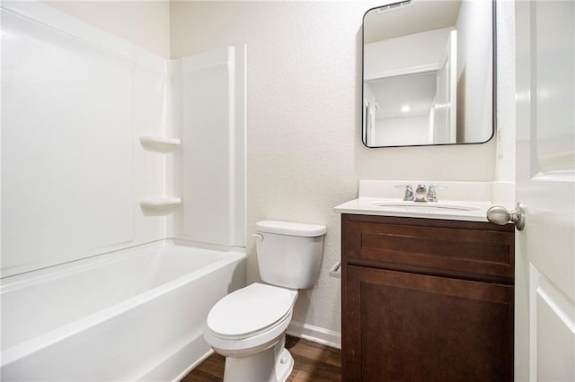 full bathroom with wood-type flooring, toilet, vanity, and bathing tub / shower combination