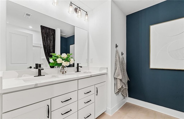 363 Aidens Blf, Jefferson, GA 30549 - bathroom with double vanity, baseboards, and tile patterned flooring