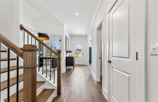 363 Aidens Blf, Jefferson, GA 30549 - corridor featuring dark wood-style floors, stairs, recessed lighting, and baseboards