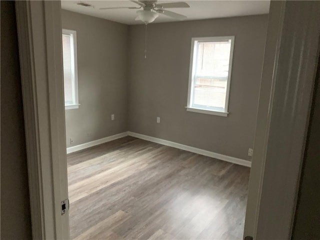 unfurnished room with ceiling fan and light hardwood / wood-style floors