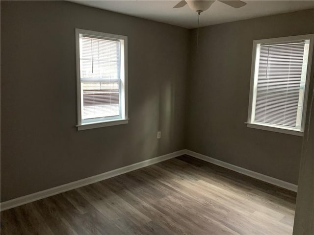 spare room featuring hardwood / wood-style floors and ceiling fan