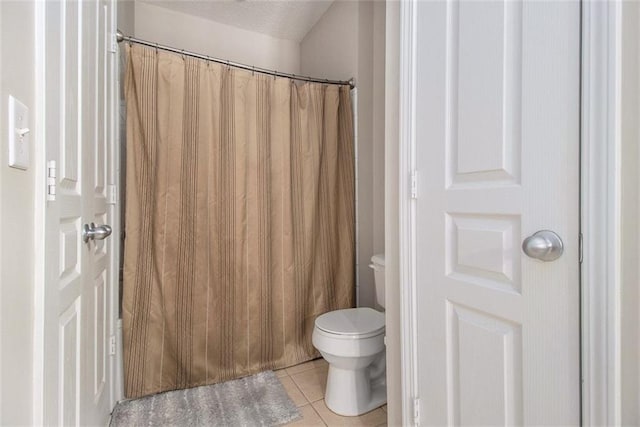 10 Perimeter Summit Blvd NE Unit 4223, Brookhaven, GA 30319 - full bath featuring tile patterned flooring, curtained shower, and a textured ceiling
