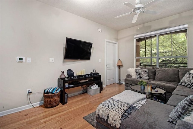 10 Perimeter Summit Blvd NE Unit 4223, Brookhaven, GA 30319 - living area featuring wood finished floors, a textured ceiling, and ceiling fan