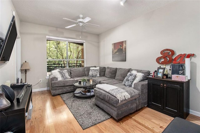 10 Perimeter Summit Blvd NE Unit 4223, Brookhaven, GA 30319 - living area featuring ceiling fan, light wood-style flooring, and a textured ceiling