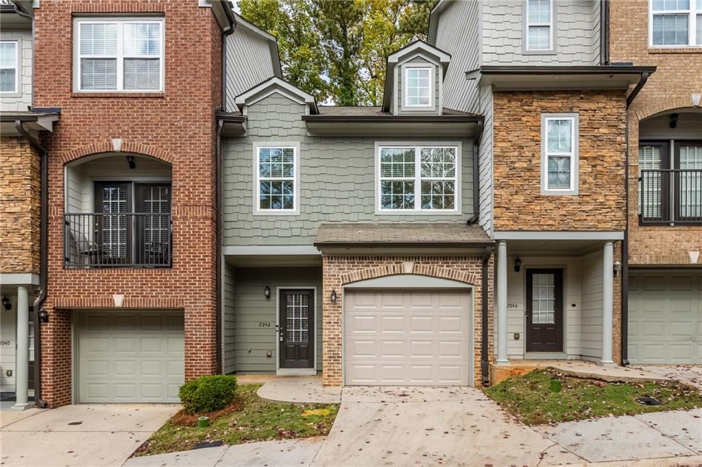 townhome / multi-family property featuring a garage