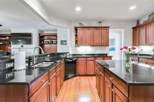 kitchen with dishwasher, sink, ornamental molding, light hardwood / wood-style flooring, and dark stone countertops