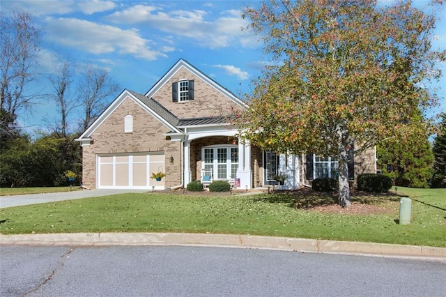 view of front of house featuring a garage and a front yard