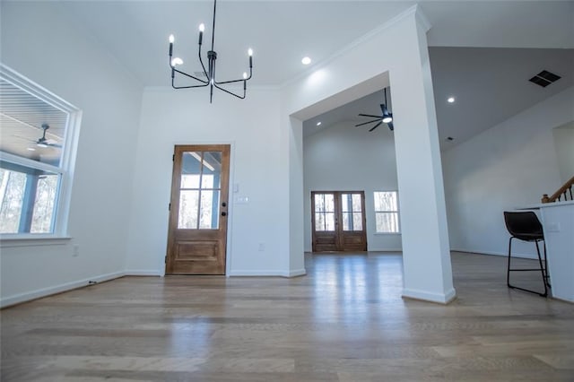 90 Ayers Rd, Bowdon, GA 30108 - foyer entrance featuring a ceiling fan, plenty of natural light, wood finished floors, high vaulted ceiling, and a chandelier