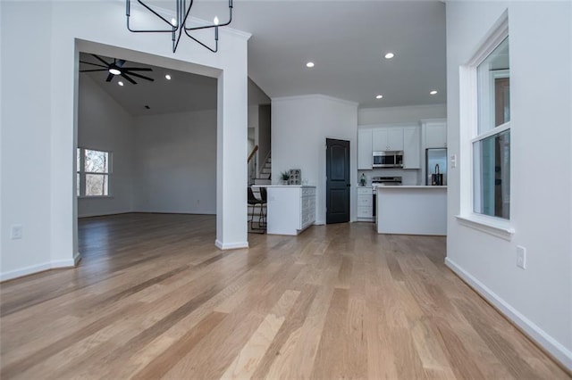 90 Ayers Rd, Bowdon, GA 30108 - unfurnished living room featuring a chandelier, light wood finished floors, stairway, recessed lighting, and ornamental molding