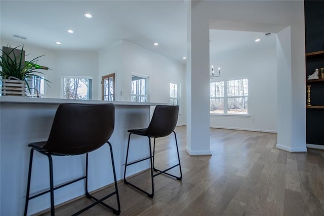 90 Ayers Rd, Bowdon, GA 30108 - kitchen with recessed lighting, wood finished floors, a chandelier, and a breakfast bar