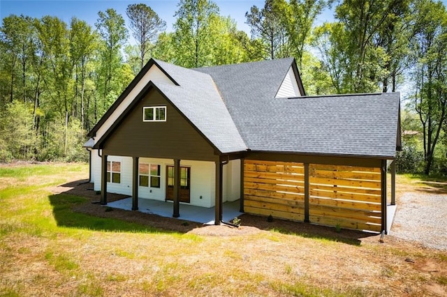 90 Ayers Rd, Bowdon, GA 30108 - view of front facade featuring a shingled roof, a porch, and a front yard