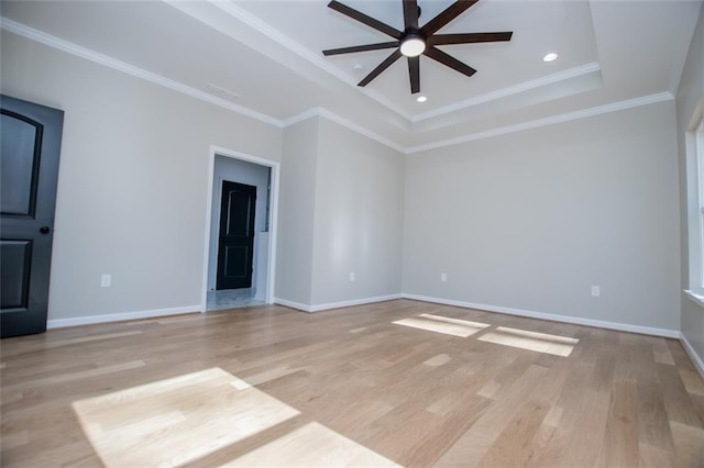 90 Ayers Rd, Bowdon, GA 30108 - spare room with ceiling fan, light wood-style flooring, a tray ceiling, recessed lighting, and ornamental molding